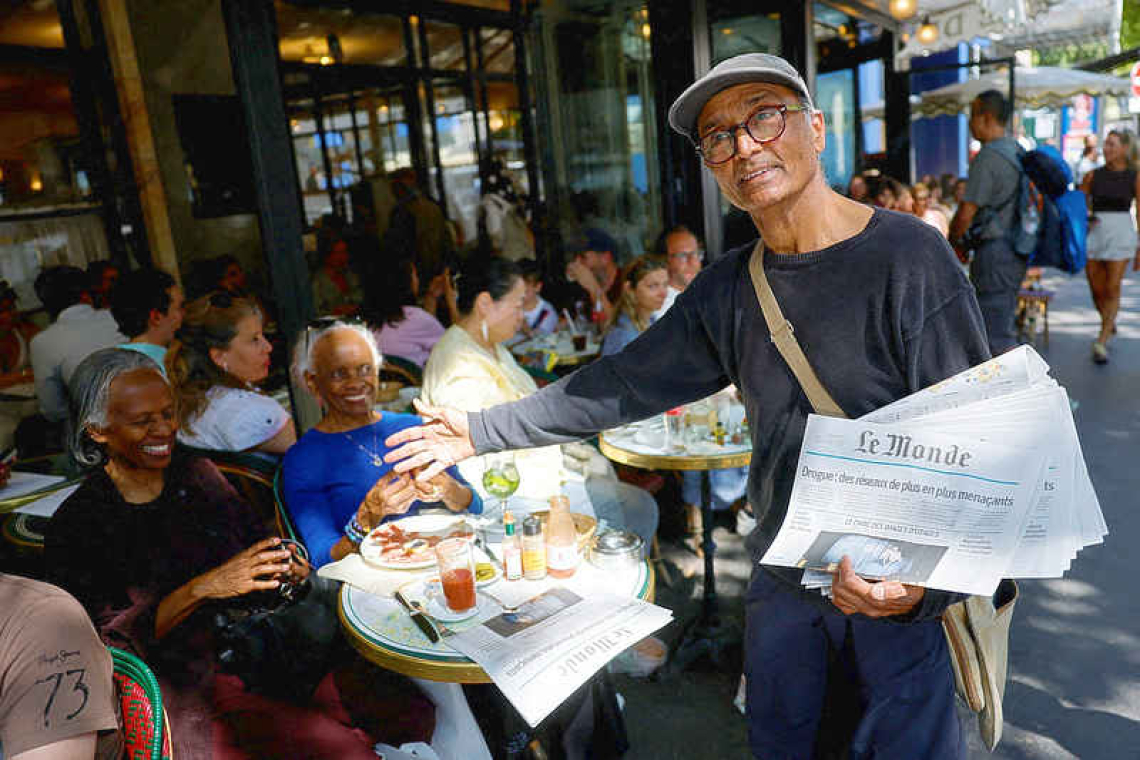 Read all about it! Macron set to honour  last Paris newspaper hawker with medal